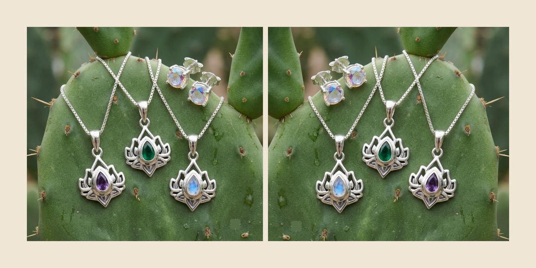 Three Lotus Collection pendants in silver set with amethyst, green, and moonstone, resting on a prickly pear cactus