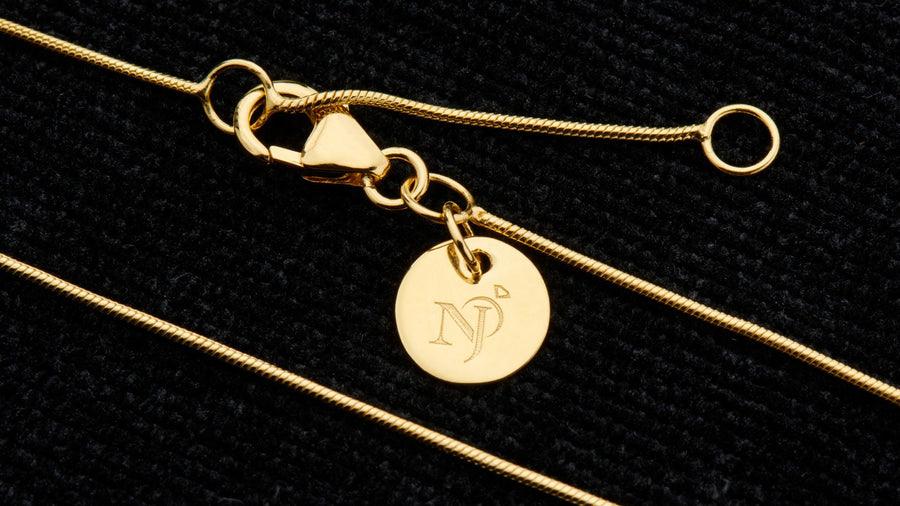 Gold snake chain with lobster clasp and Nugent Jewelry tag