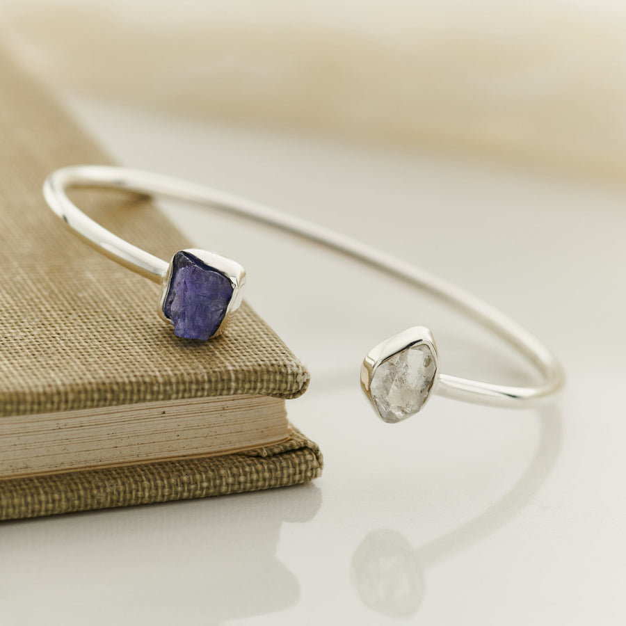 Open silver cuff with raw tanzanite and Herkimer diamond ends