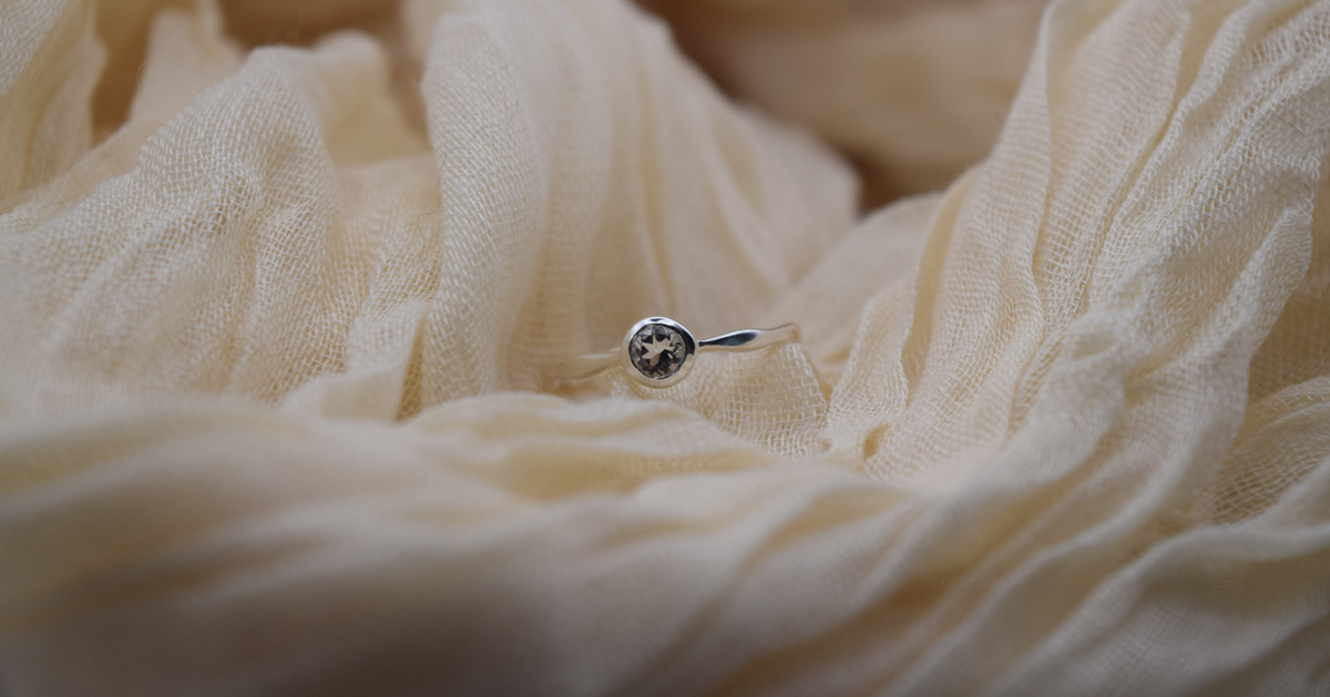 Round-cut clear quartz ring in fine silver