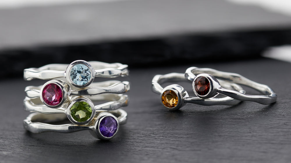 Round-cut blue topaz ring in fine silver